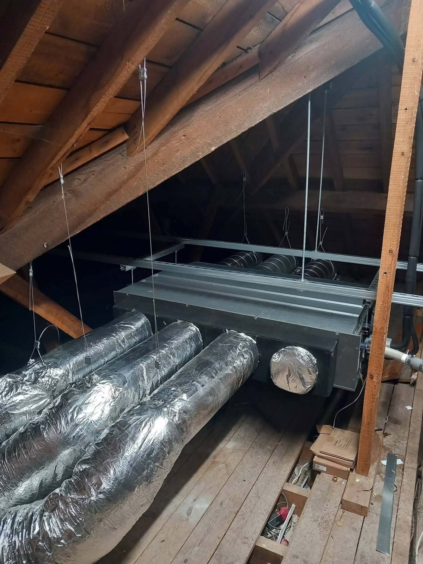 Mitsubishi Ecodan air source heat pump installed on concrete plinth outside a residential property in Hampshire