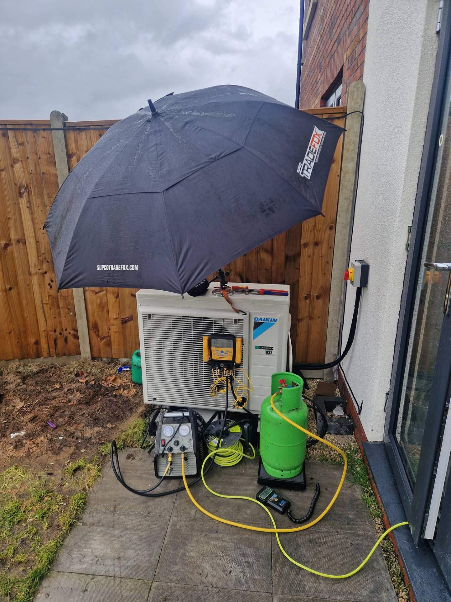 Completed domestic air conditioning installation with trunking neatly routed along wall