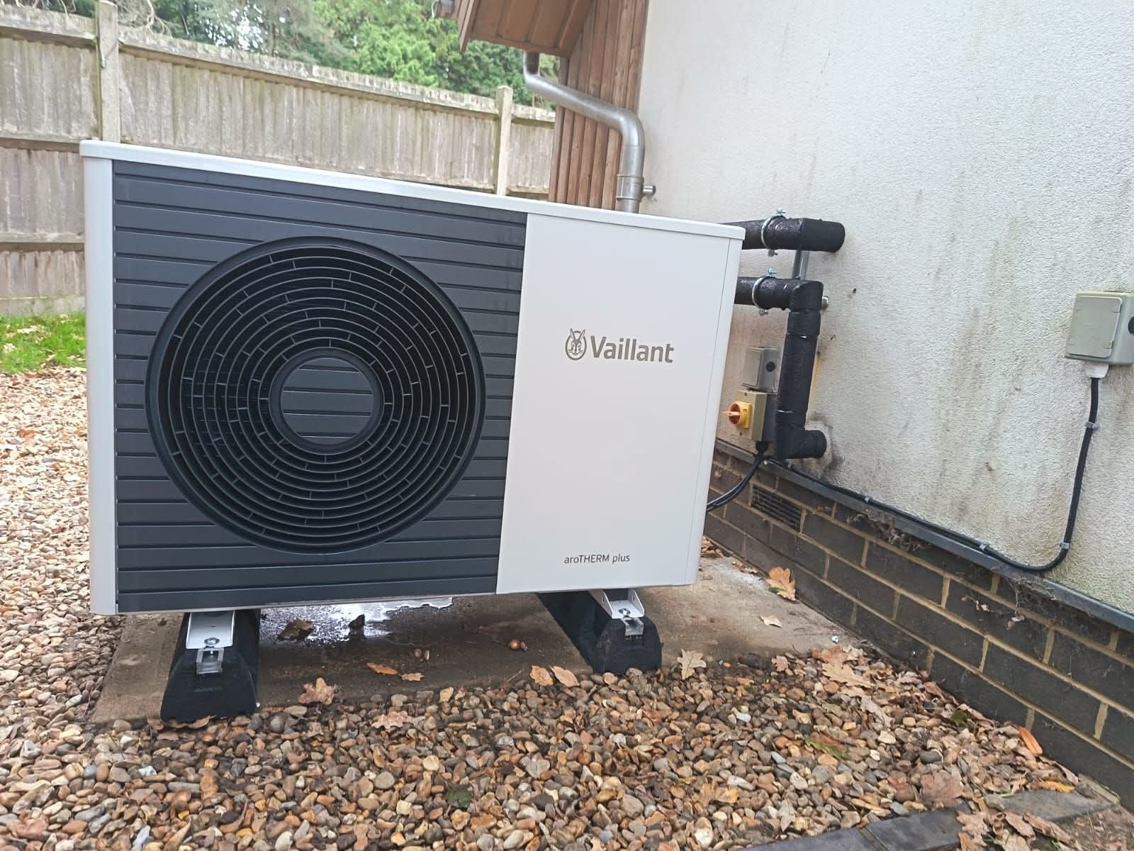 Ecodan heat pump outdoor unit with pipework lagging and electrical isolator switch