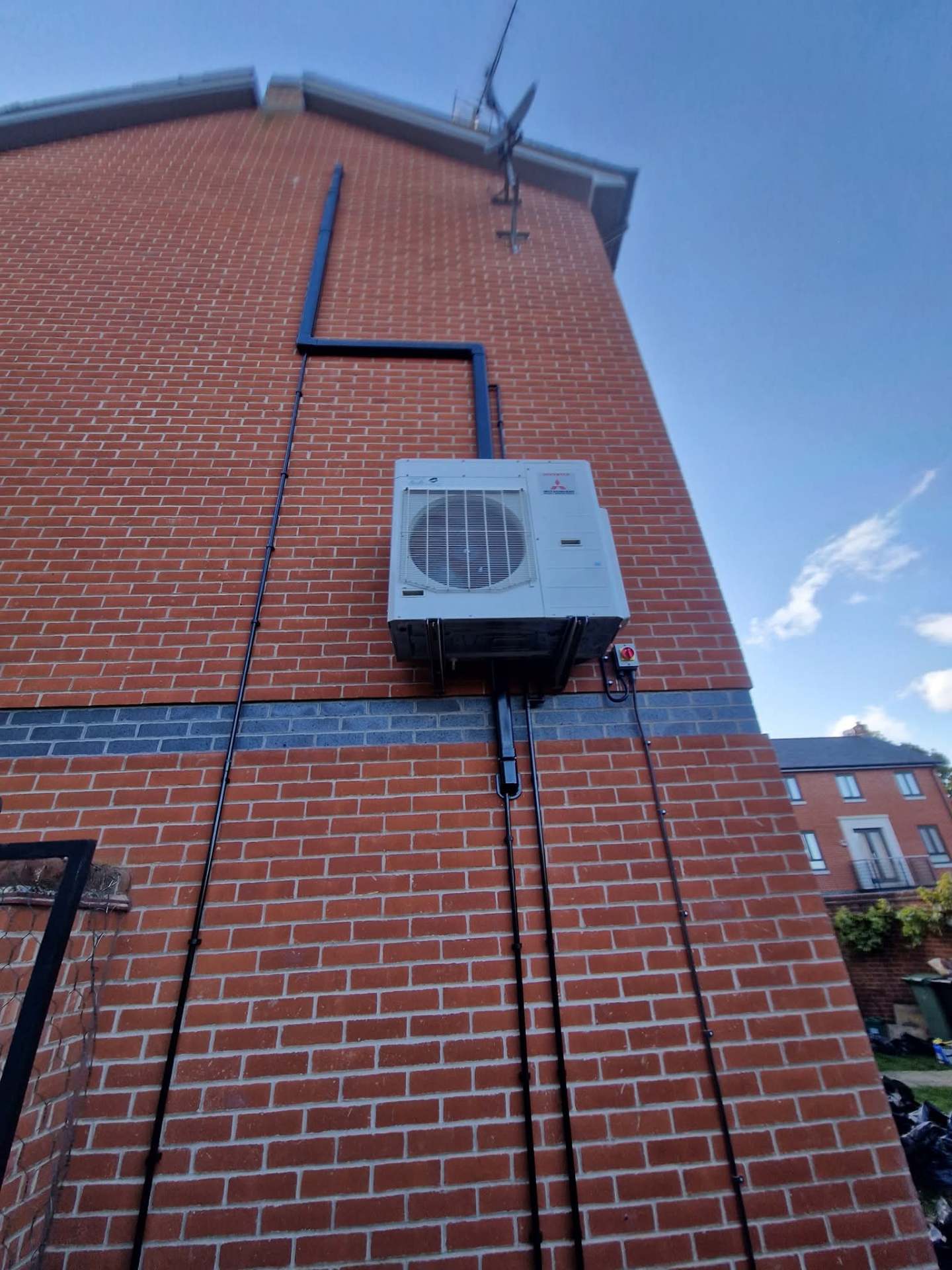 Commercial ceiling cassette being installed in office building ceiling grid
