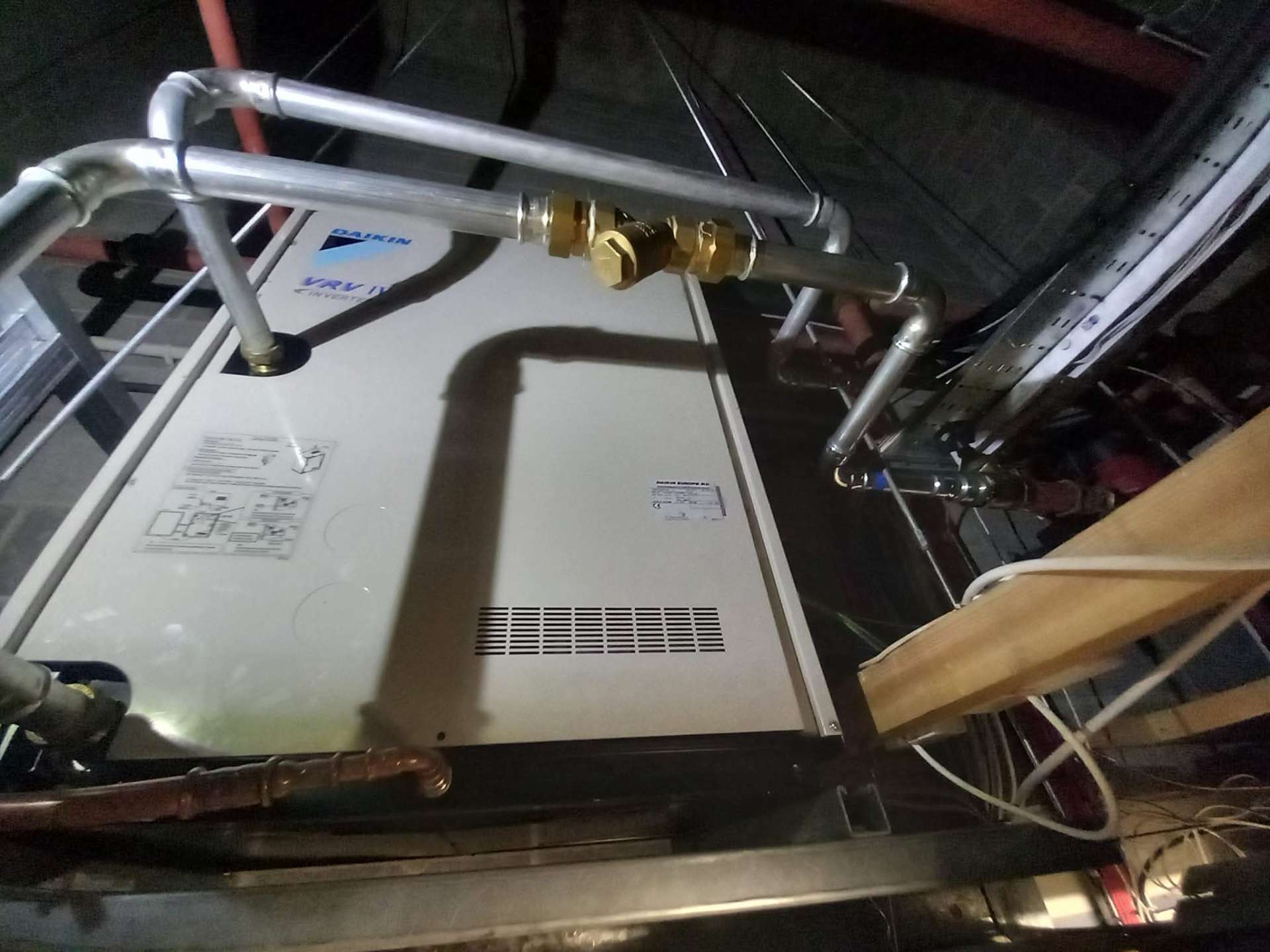 Outdoor condenser unit defrosting during cold weather operation in Hampshire winter